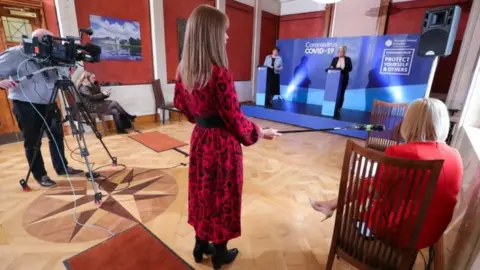 PA Media First Minister Arlene Foster and Deputy First Minister Michelle O'Neill at one of the Northern Ireland Executive's daily press update on the response to the Covid-19 crisis