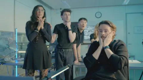 The Scam Interceptor team look tense in the control room.