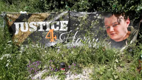 Reuters/Andrew Boyers Justice for Harry banner