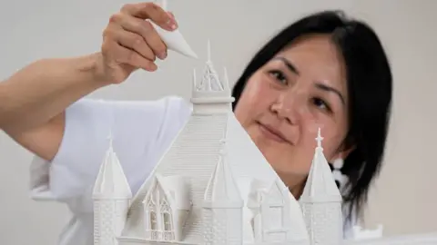 Aaron Chown/PA Wire Michelle Wibowa and her Tower Bridge model