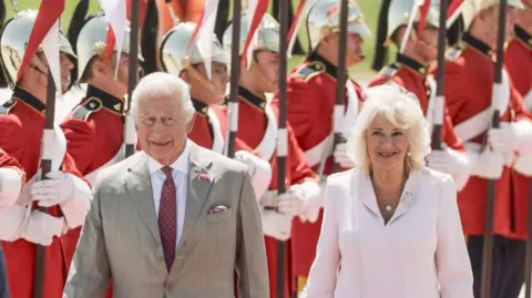 EPA Britain's King Charles III (L) and Queen Camilla (R) are greeted as they arrive for a state visit at Ottawa MacDonald-Cartier International Airport in Ottawa, Canada, 26 May 2025