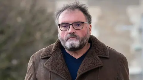 ARNAUD FINISTRE/AFP French former anaesthetist Frederic Pechier arrives at Besancon's courthouse on the day his lawyer is due to present from today onwards the defense's closing arguments in Besancon, eastern France, on December 15, 2025