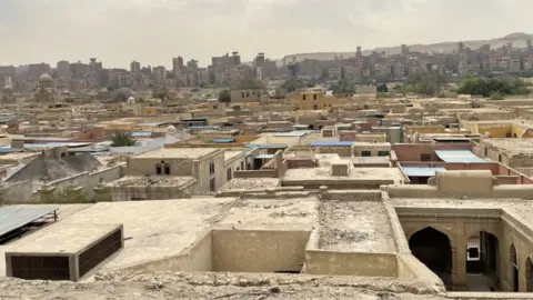 Wael Hussein View of the City of the Dead, a series of vast Islamic-era necropolises and cemeteries in Cairo, where hundreds of poor Egyptians live next to the dead