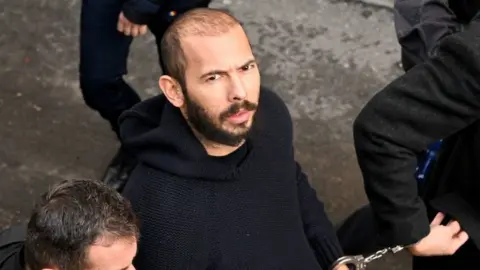 AFP via Getty Images Andrew Tate