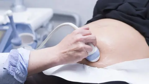 Getty Images A woman receives an ultrasound