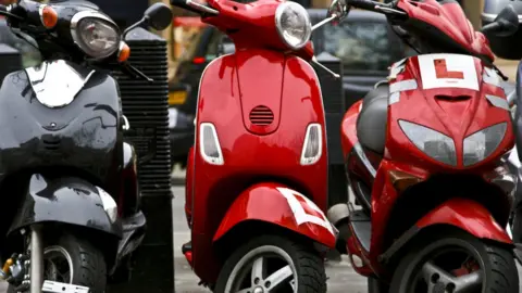 Getty Images Mopeds parked