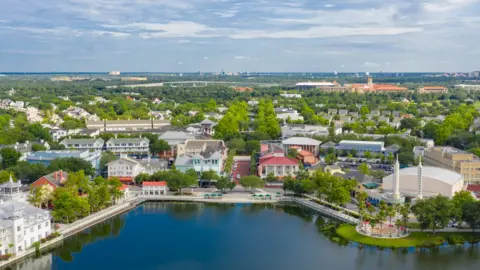 Getty Images The idyllic town of Celebration, Florida, seen from the air, with Walt Disney World in the background