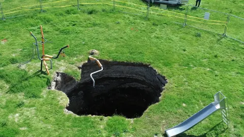 Andrew Buckley The sinkhole appeared last year on the site of a children's playground