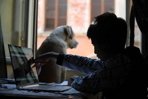 Alberto Lingria / Reuters A boy with his dog