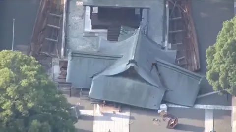 The roof of a temple is destroyed due to an earthquake.