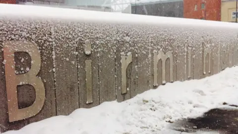 Snowy sign at Birmingham New Street railway station