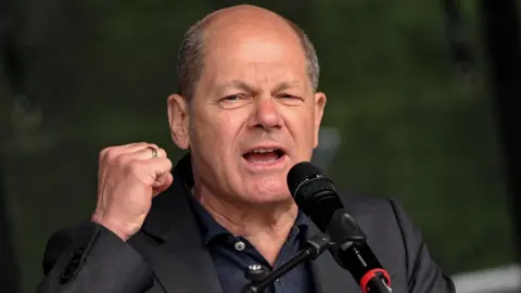 EPA German Chancellor Olaf Scholz delivers a speech during a Labor Day rally organized by the German Trade Union Confederation (DGB) to mark International Workers Day in Dusseldorf, Germany, 01 May 2022