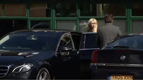 Sally Collier getting into car last week