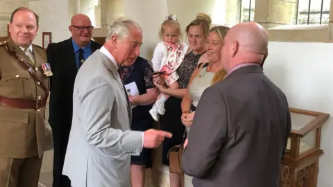 Prince Charles with the family of a fallen soldier