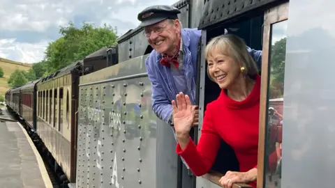 Jenny Agutter and train driver Nicholas Hallewell on a train at Oakworth station