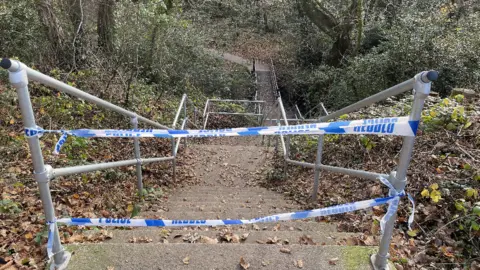 PA Media Woods cordoned off behind the Crown Hill estate in Llantwit Fardre