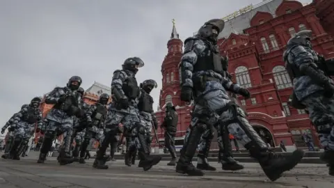 EPA Riot police at a demonstration in Moscow on Sunday