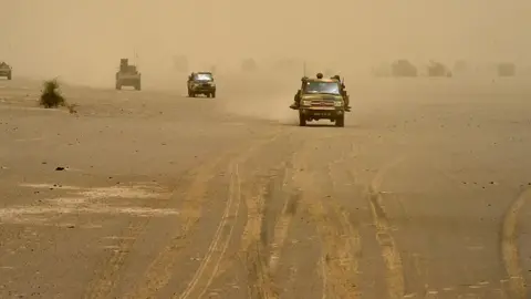 AFP Vehicles carrying French and Malian soldier in the northern Timbuktu region of Mali - 2015