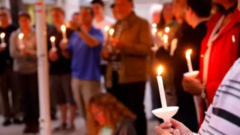 Reuters A candlelight vigil is held at Rancho Bernardo Community Presbyterian Church for victims of a shooting in Poway, north of San Diego, California, April 27, 2019