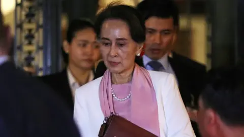 Reuters Myanmar's leader Aung San Suu Kyi leaves the International Court of Justice (ICJ), the top United Nations court, after court hearings in The Hague, Netherlands, 12 December, 2019