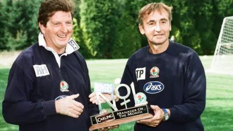 Albert Cooper/Mirrorpix/Getty Images Roy Hodgson holding the Carling Manager of the Month Award with assistant Tony Parkes in 1997