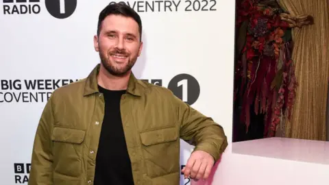 Getty Images Danny Howard on the red carpet