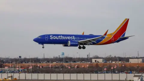 Getty Images A Southwest plane lands at a Chicago airport in December