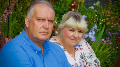 Martin Giles/BBC Maxine and Nick Fulcher