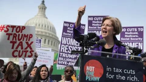 Getty Images Sen. Elizabeth Warren (D-MA) addresses a rally against the Republican tax plan outside the U.S. Capitol November 1, 2017 in Washington, DC.