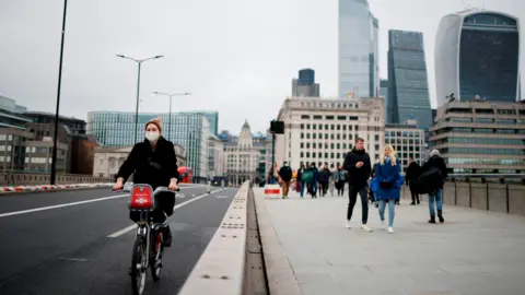 Getty Images cyclist on a bridge in London