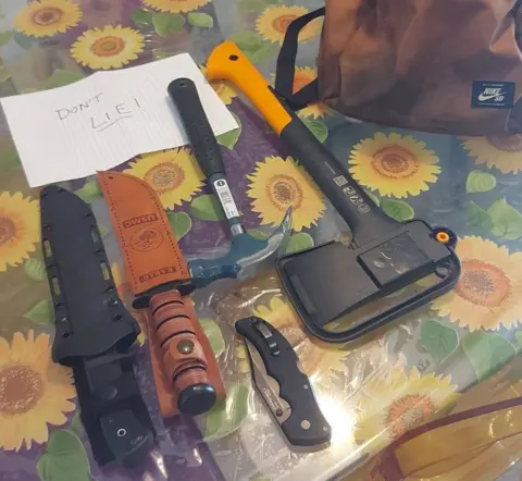 Anna White Bag of weapons photographed on table