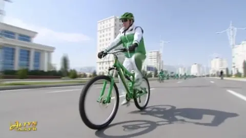 Turkmen state TV Gurbanguly Berdymukhamedov riding a bike (file photo)