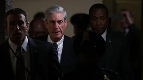 Getty Images Robert Mueller walks through the halls of Congress.