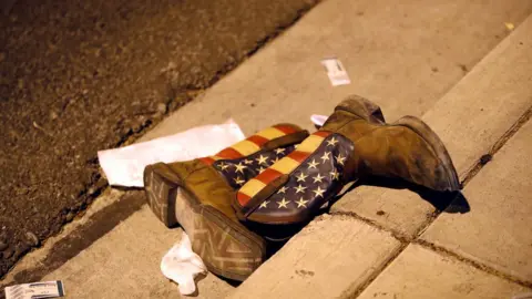 Reuters pair of cowboy boots on street