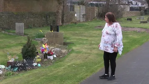 Julie at the grave