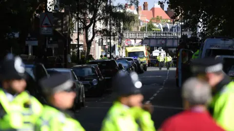 Getty Images The emergency services are seen near the police cordon at Parsons Green Underground Station on September 15, 2017 in London, England. Emergency services are investigating reports of an explosion at the West London tube station. (