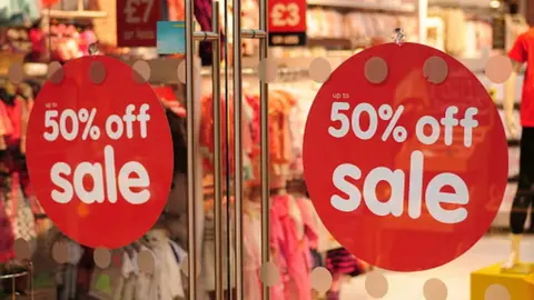 Getty Images Sale signs on shop window