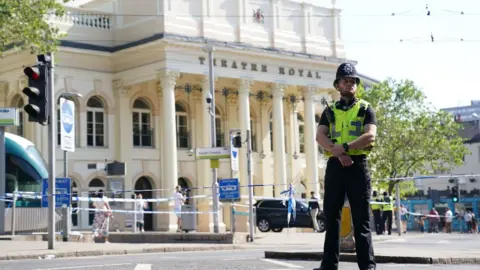 PA Media Police officer outside the Theatre Royal in Nottingham