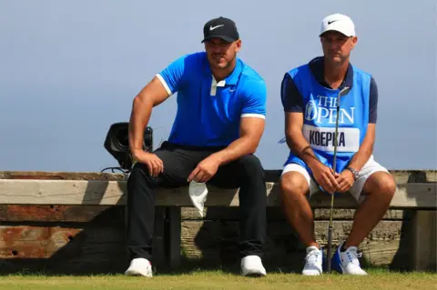 Allsport Brooks Koepka and Ricky Elliott at Royal Portrush