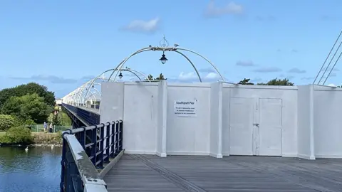 BBC Southport Pier with boards across to show it's closed