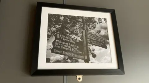 OLI CONSTABLE/BBC Image of sign post to London destinations, displayed in Greggs in Richmond North Yorkshire