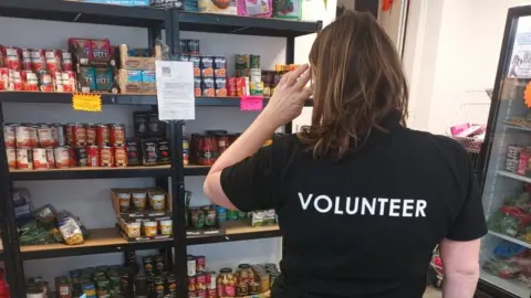 NBIL Volunteer at foodbank