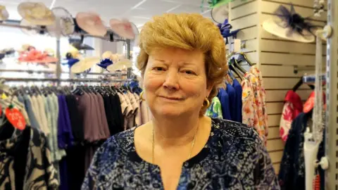 PAUL MOSELEY/BBC Gwen Bye, owner of a wedding and special occasion dress shop