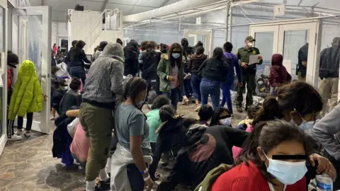 Reuters Migrants at the US Customs and Border Protection temporary processing centre in the city of Donna