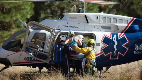 Empics Mrs Foster is rescued from Yosemite following a rock fall