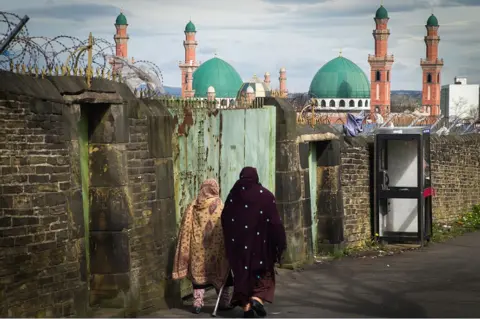 Getty Images Women walk towards mosque in Bradford