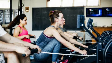 Getty Images Working out at the gym