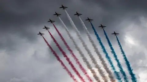 AFP/Getty Images French elite acrobatic flying team Patrouille de Fracne performed over Arromanches