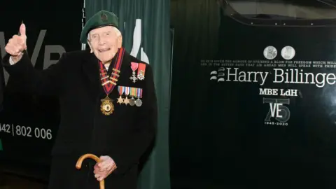 GWR Harry Billinge with thumbs up next to his train