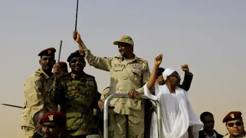 Reuters General Dagalo (centre) greets supporters near Khartoum. Photo: June 2023